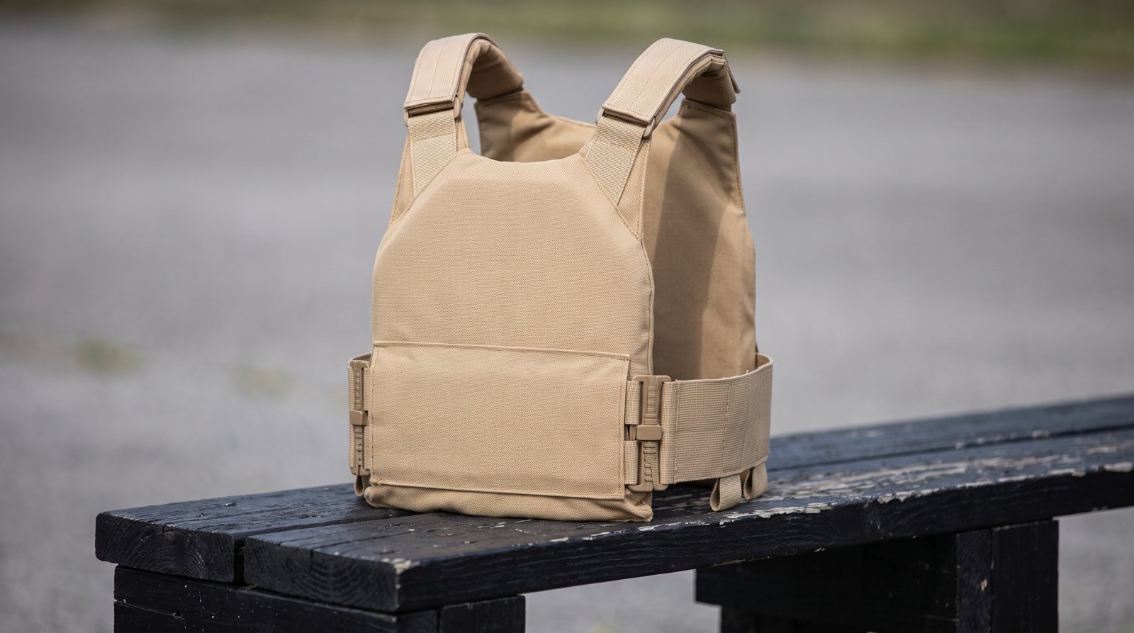 An unworn plate carrier showing its shoulder straps and side fastenings.