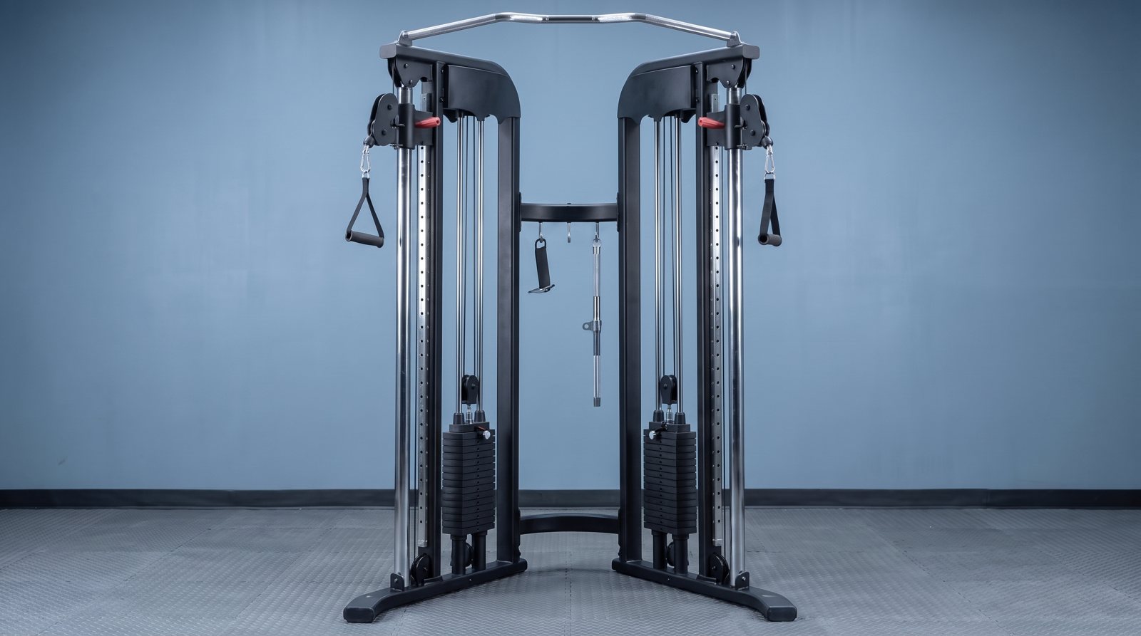 A cable trainer showing its pulleys and handles.