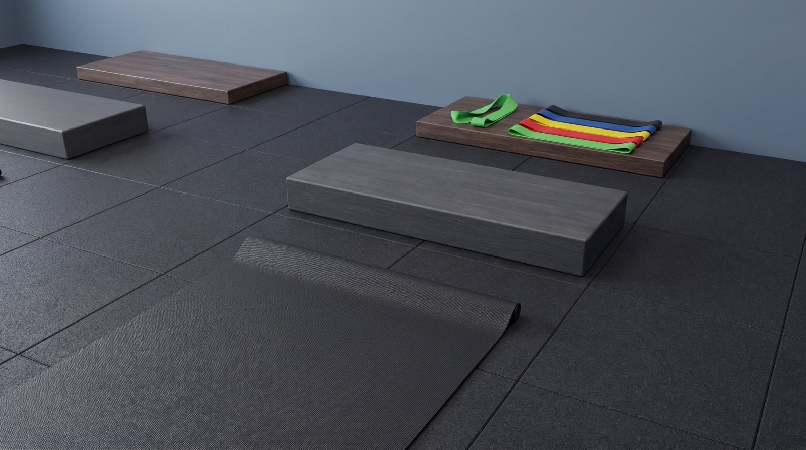 A mat, low step and resistance loops in separate workout spaces.