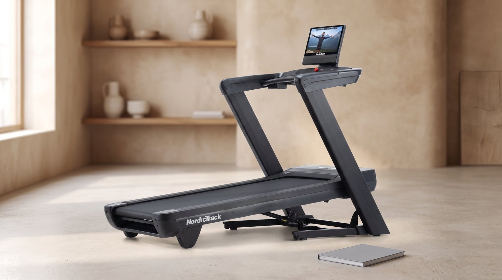 The NordicTrack Commercial 1750 treadmill beside a closed manual.