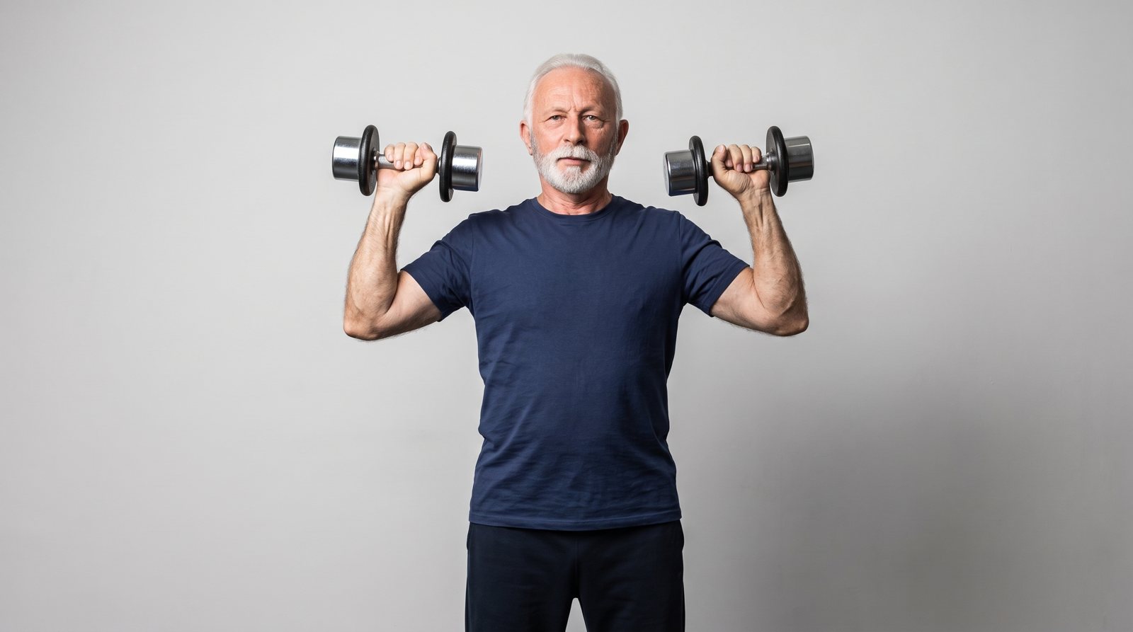 Dumbbells held at shoulder height before a shoulder press.