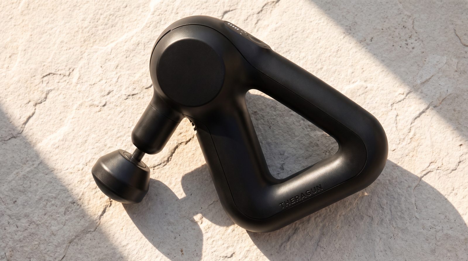 The referenced Theragun Prime Gen4 showing its triangular handle and attached head.